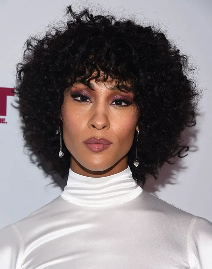 Voluminous Shoulder-Length Shag With Full Bangs Voluminous Shoulder-Length Shag With Full Bangs — Classy Curly Hairstyles for Black Women