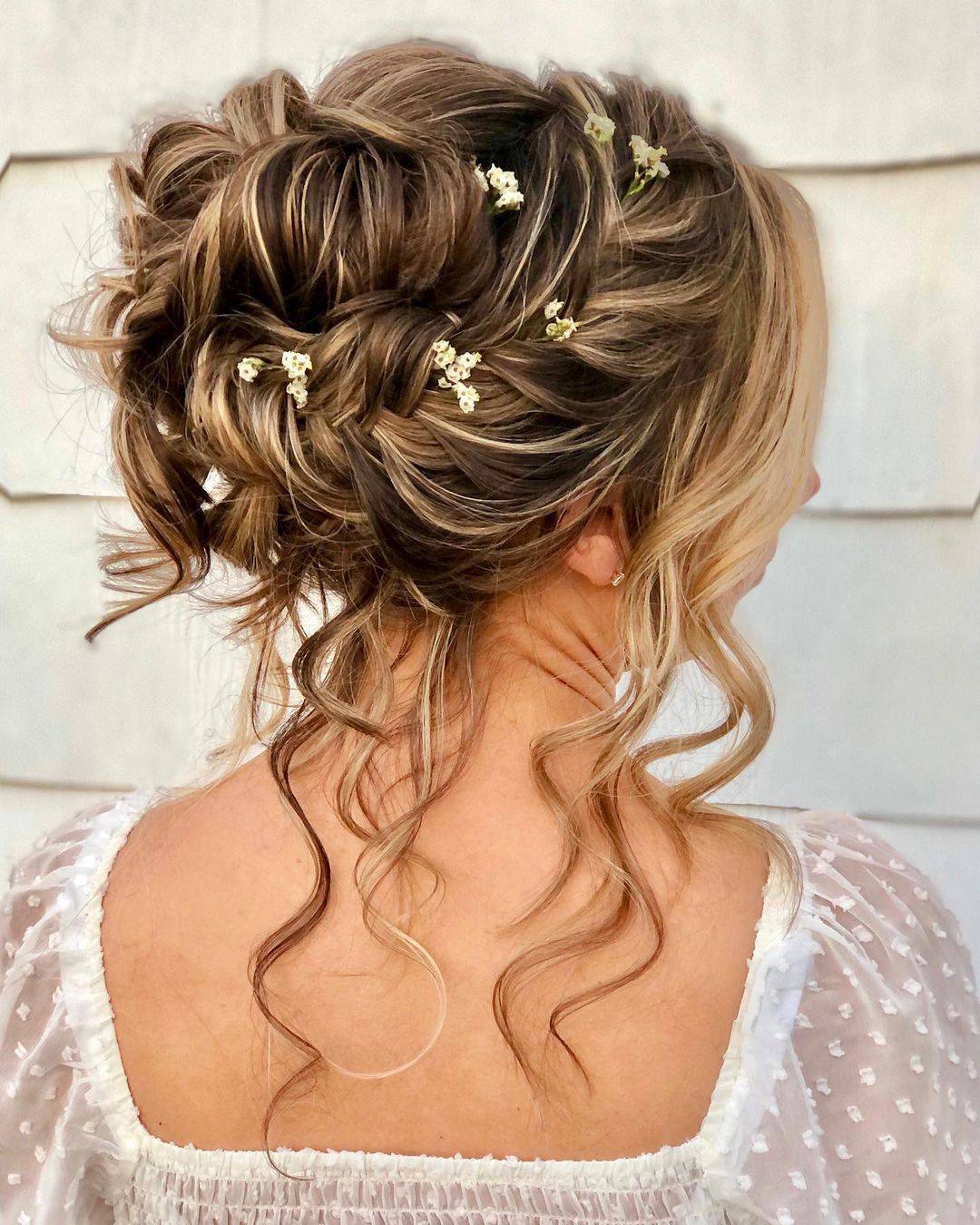 Blonde Updo With Braided Accents and Flowers Blonde Updo With Braided Accents and Flowers — Classy Curly Updo