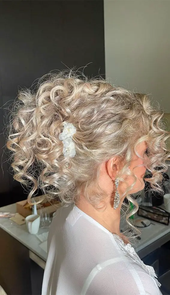 Ash Blonde Updo With Defined Curls and Curtain Bangs Ash Blonde Updo With Defined Curls and Curtain Bangs — Classy Curly Updo