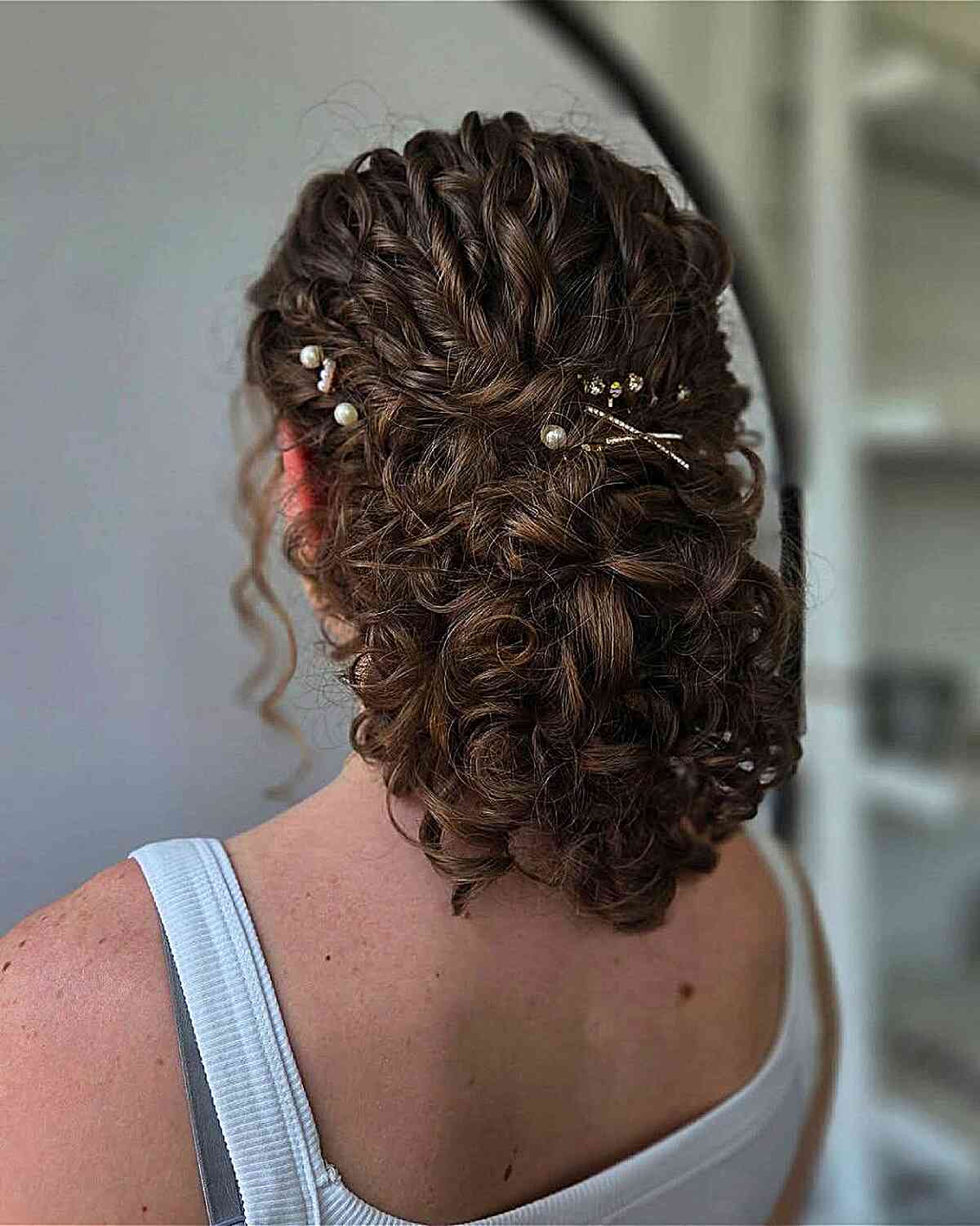 Textured Dark Brown Updo With Pearl Pins Textured Dark Brown Updo With Pearl Pins — Classy Curly Updo