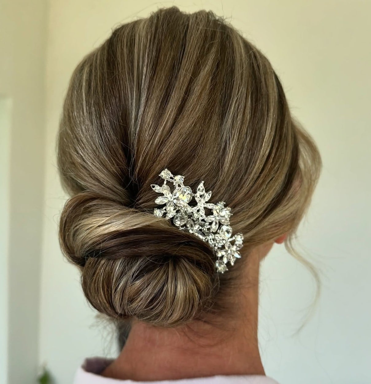 Brown Low Chignon With Wispy Bangs Brown Low Chignon With Wispy Bangs — Classy Dance Hair