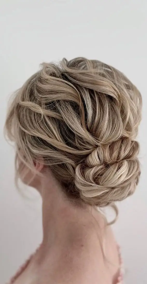Low Messy Bun With Loose Wavy Strands Low Messy Bun With Loose Wavy Strands — Classy Dirty Hair Hairstyles