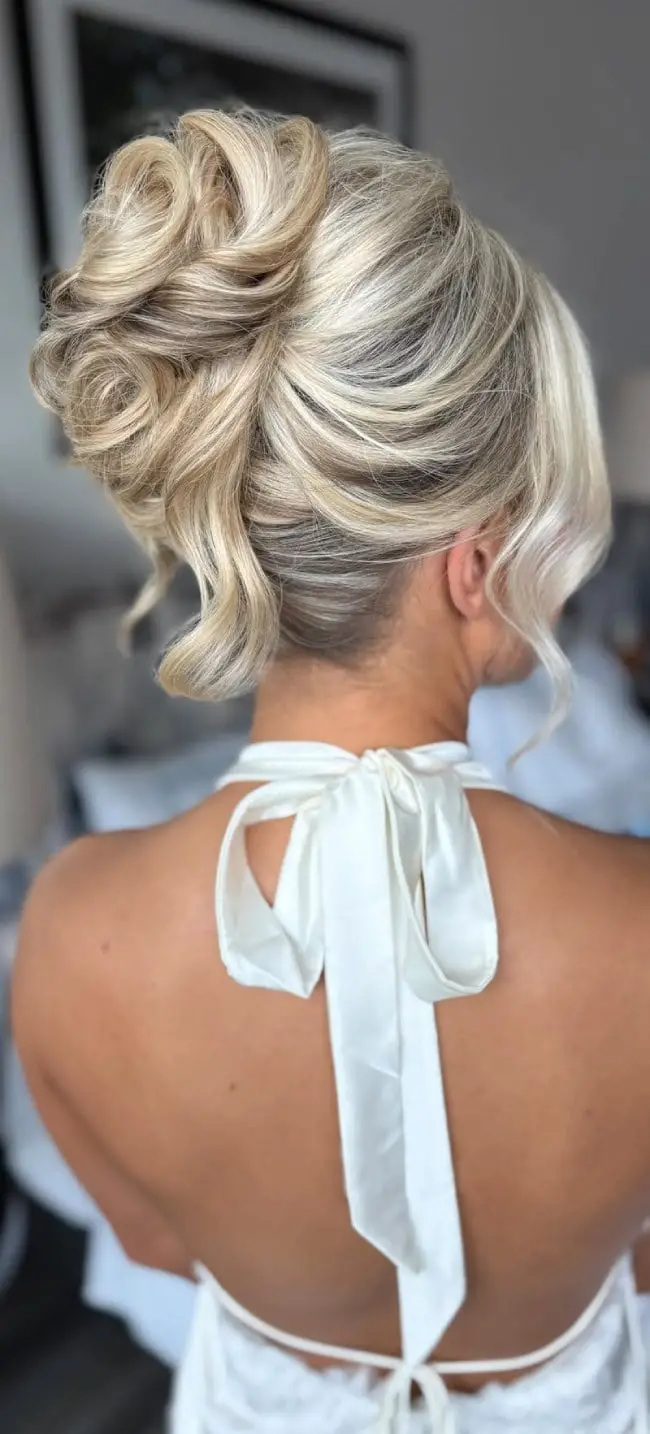 Sculpted Blonde Chignon With Wispy Bangs — Classy Formal Updos