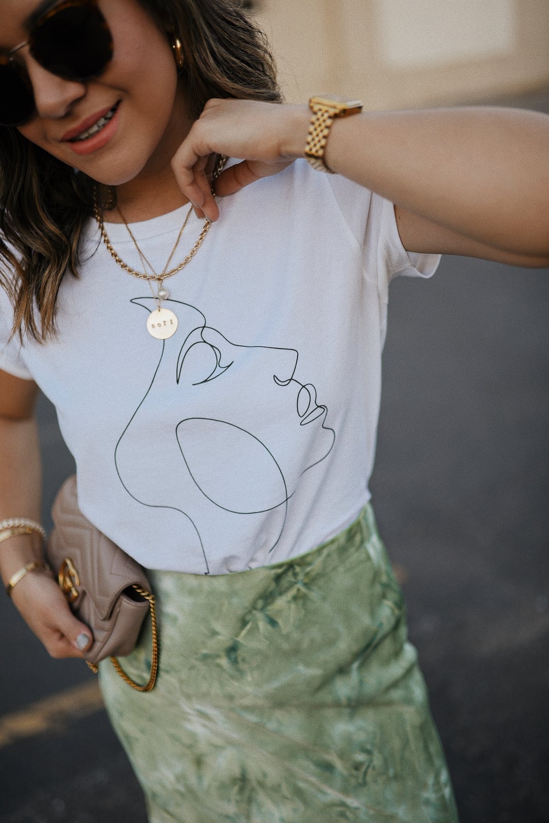 White Graphic Tee with Line Art Face and Satin Midi Skirt White Graphic Tee with Line Art Face and Satin Midi Skirt — Classy Graphic Tee Outfits