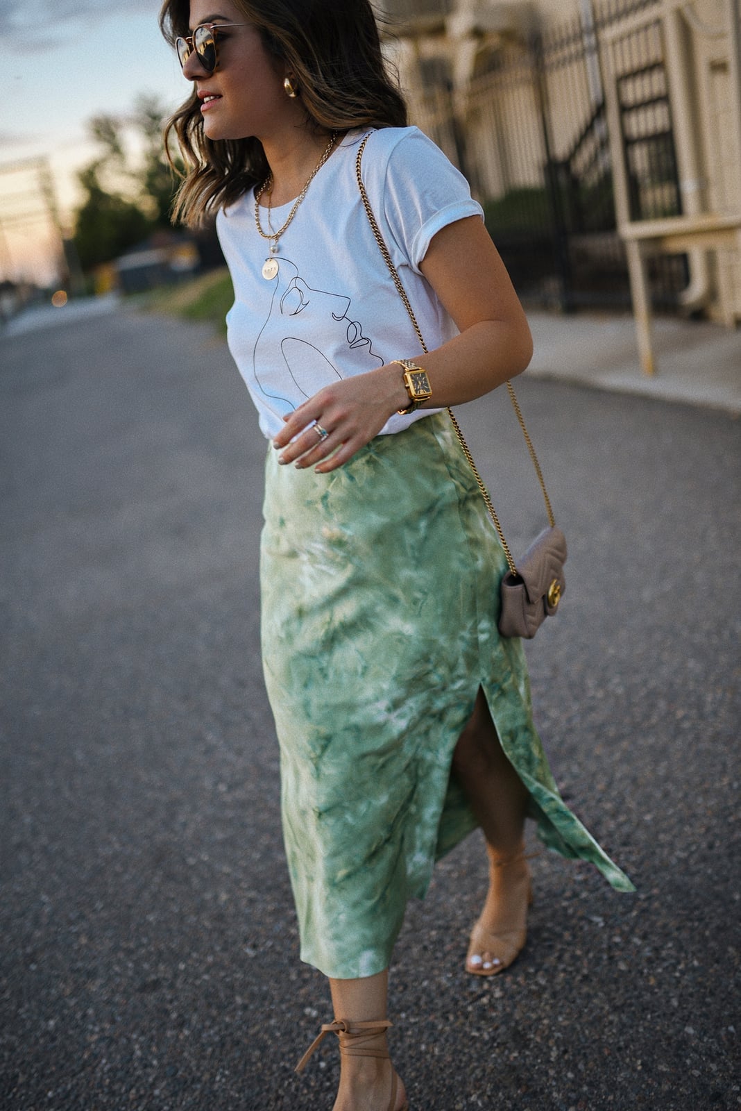 White Graphic Tee with Face Print and Tie-Dye Satin Skirt White Graphic Tee with Face Print and Tie-Dye Satin Skirt — Classy Graphic Tee Outfits