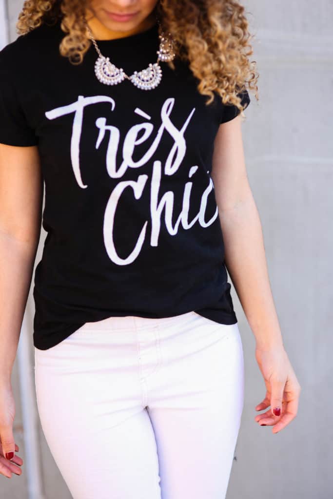 Black Graphic Tee with 'Très Chic' Script and Statement Necklace Black Graphic Tee with 'Très Chic' Script and Statement Necklace — Classy Graphic Tee Outfits