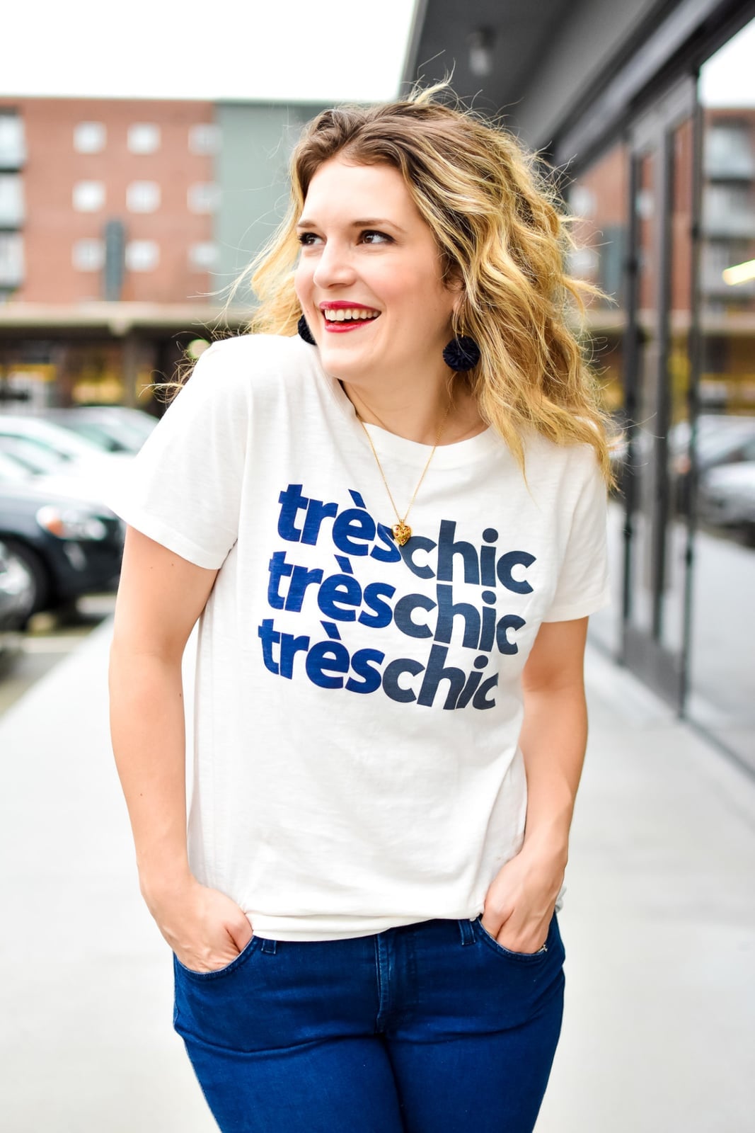 Fitted White Graphic Tee with Blue Text and Dark Jeans Fitted White Graphic Tee with Blue Text and Dark Jeans — Classy Graphic Tee Outfits