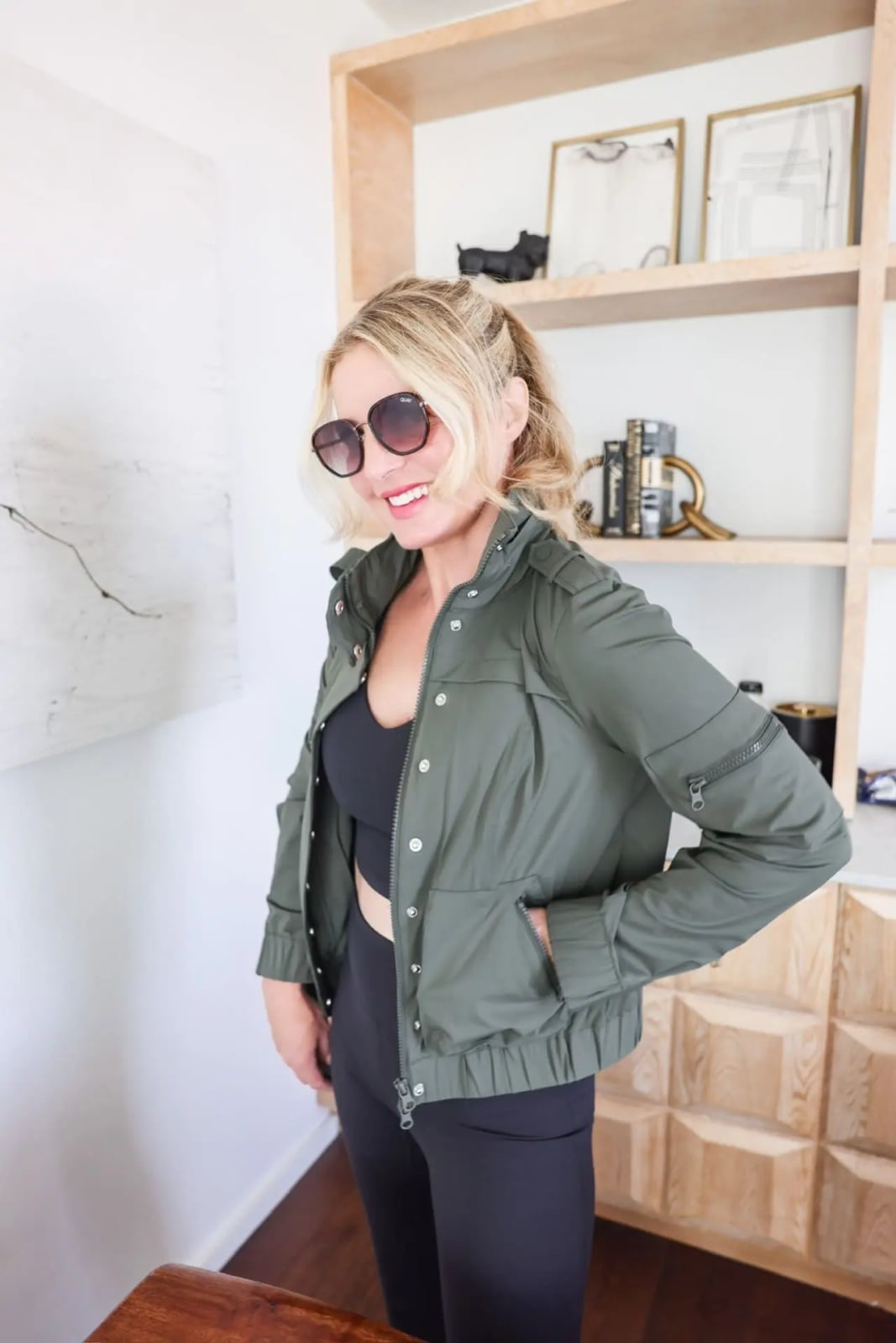 Olive Green Bomber Jacket Over Black Gym Set With Performance Fabric Olive Green Bomber Jacket Over Black Gym Set With Performance Fabric — Classy Gym Outfits
