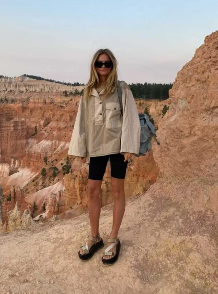 Oversized Beige Shirt with Black Cycling Shorts and Sandals Oversized Beige Shirt with Black Cycling Shorts and Sandals — Classy Hiking Outfits