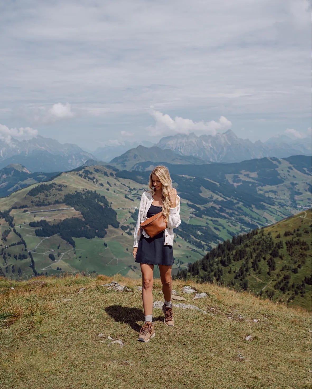 Navy A-line Dress with White Jacket and Brown Boots Navy A-line Dress with White Jacket and Brown Boots — Classy Hiking Outfits
