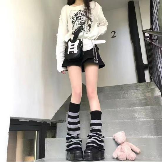 White Distressed Sweater With Black Skirt And Striped Leg Warmers White Distressed Sweater With Black Skirt And Striped Leg Warmers — Classy Leg Warmers Outfits