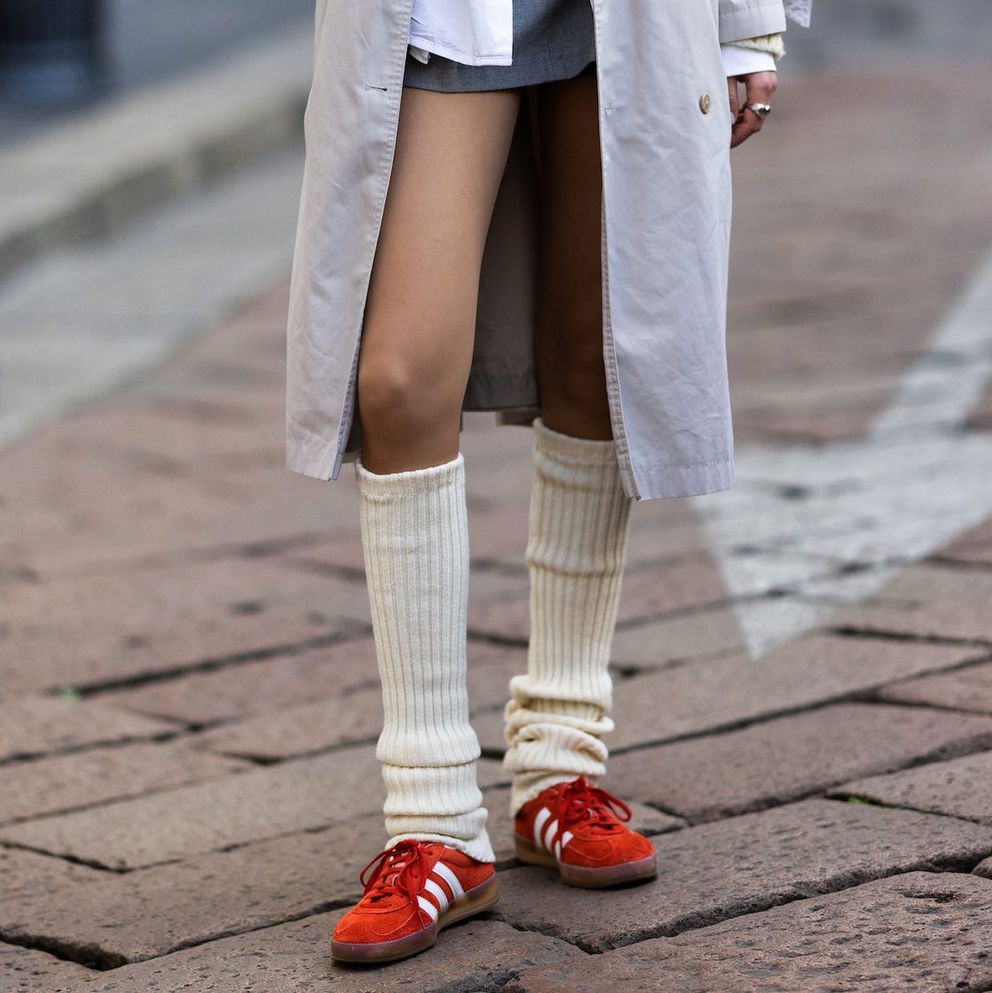 Cream Ribbed Leg Warmers With Red Slides And Trench Coat Cream Ribbed Leg Warmers With Red Slides And Trench Coat — Classy Leg Warmers Outfits
