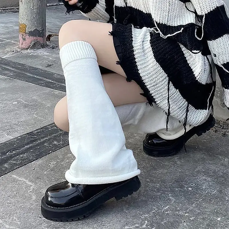 Black Sweater With White Leg Warmers And Platform Shoes, Close-Up Take Black Sweater With White Leg Warmers And Platform Shoes, Close-Up Take — Classy Leg Warmers Outfits