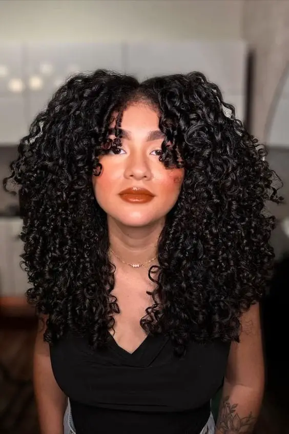 Voluminous Black Shoulder Length Curls With Bangs Voluminous Black Shoulder Length Curls With Bangs — Classy Long Curly Hair