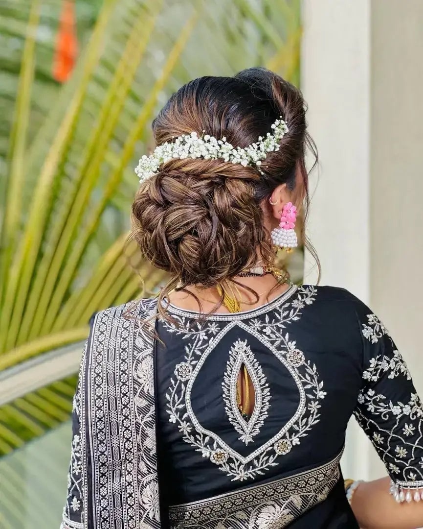 Voluminous Braided Dark Brown Updo With Floral Accent — Classy Messy Bun Outfit