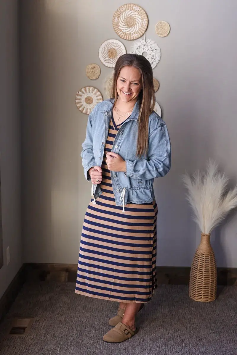 A Denim Jacket Layers Over a Striped Midi Dress for a Casual Vibe — Classy Mom Outfits