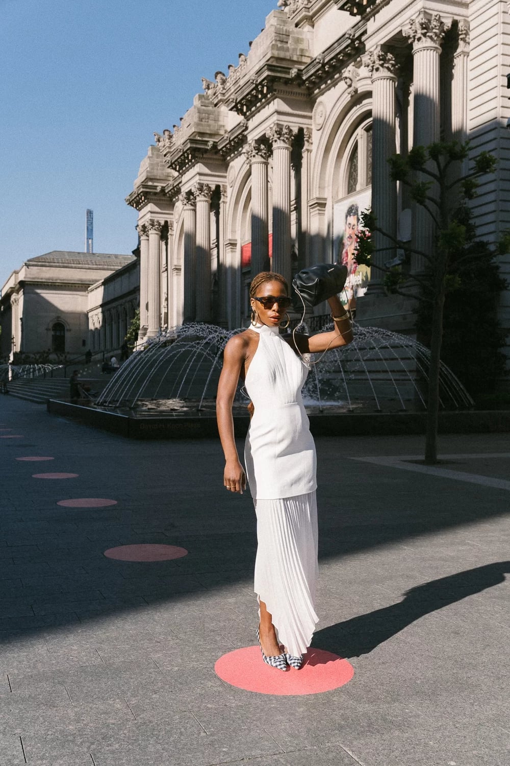 A Halter Neck Top With A Pleated Skirt — Classy Museum Outfits