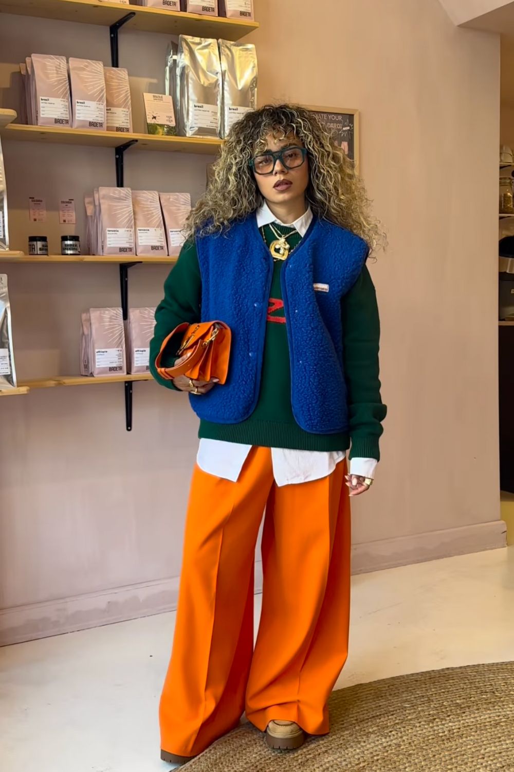 Bright Orange Wide Leg Trousers with Layered Tops and Vest — Classy Orange Pants Outfits