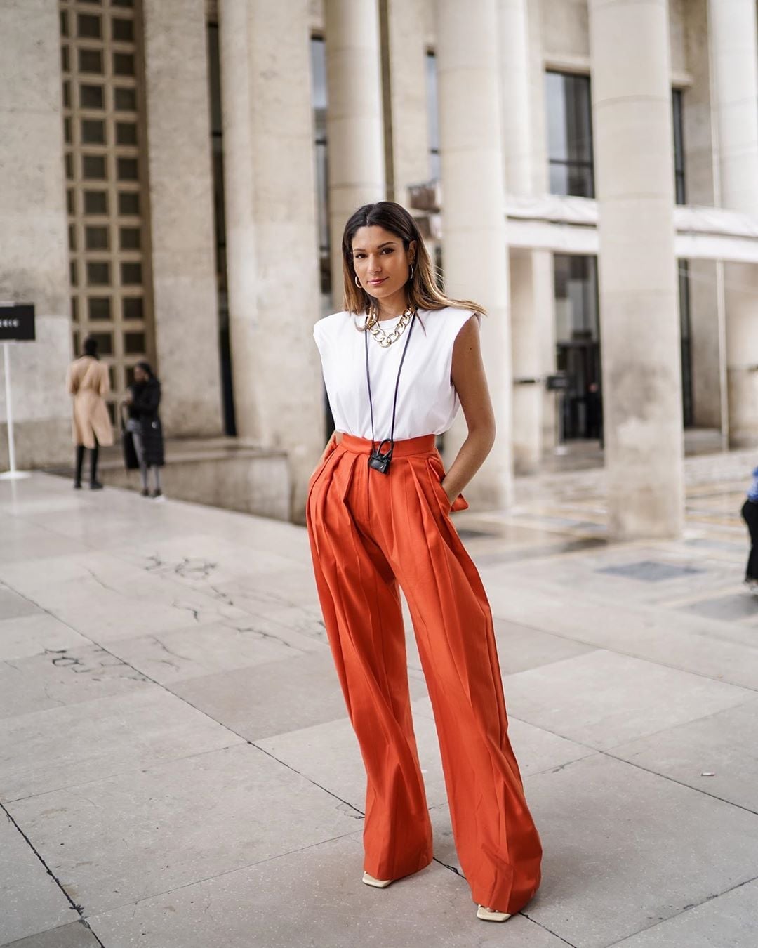 Bright Orange Wide Leg Trousers with White Top and Gold Necklace — Classy Orange Pants Outfits