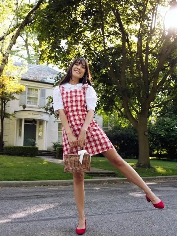 Red Gingham Pinafore Dress Over White Puff-Sleeve Blouse Red Gingham Pinafore Dress Over White Puff-Sleeve Blouse — Classy Picnic Outfit