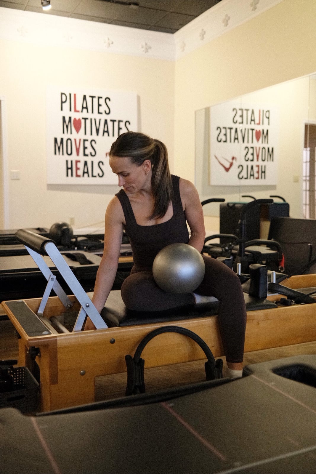 Deep Brown Ribbed Knit Set On Pilates Reformer — Classy Pilates Outfits