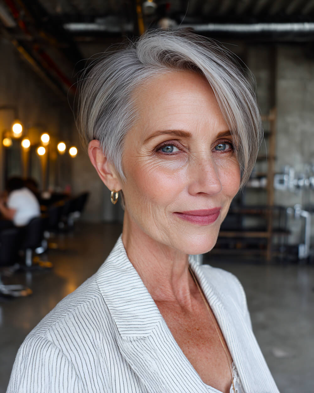 Silver Gray Pixie Bob With Long Side Bangs Silver Gray Pixie Bob With Long Side Bangs — Classy Pixie Cut