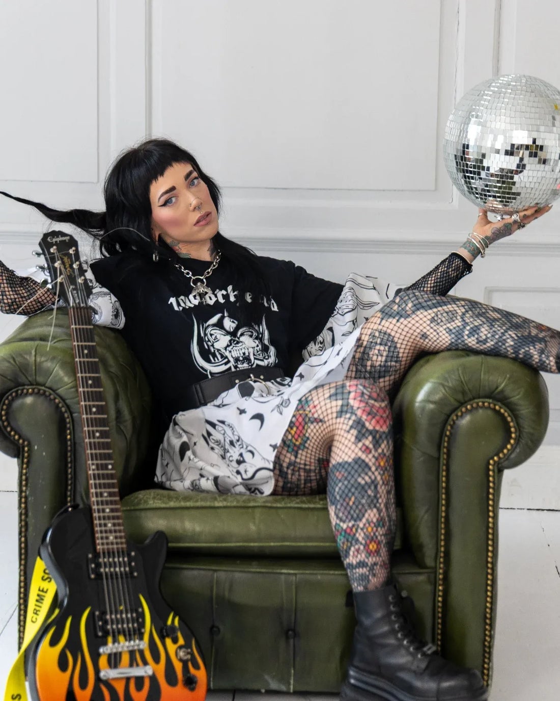 Graphic T-Shirt with Fishnet Sleeves and Combat Boots — Classy Punk Outfits