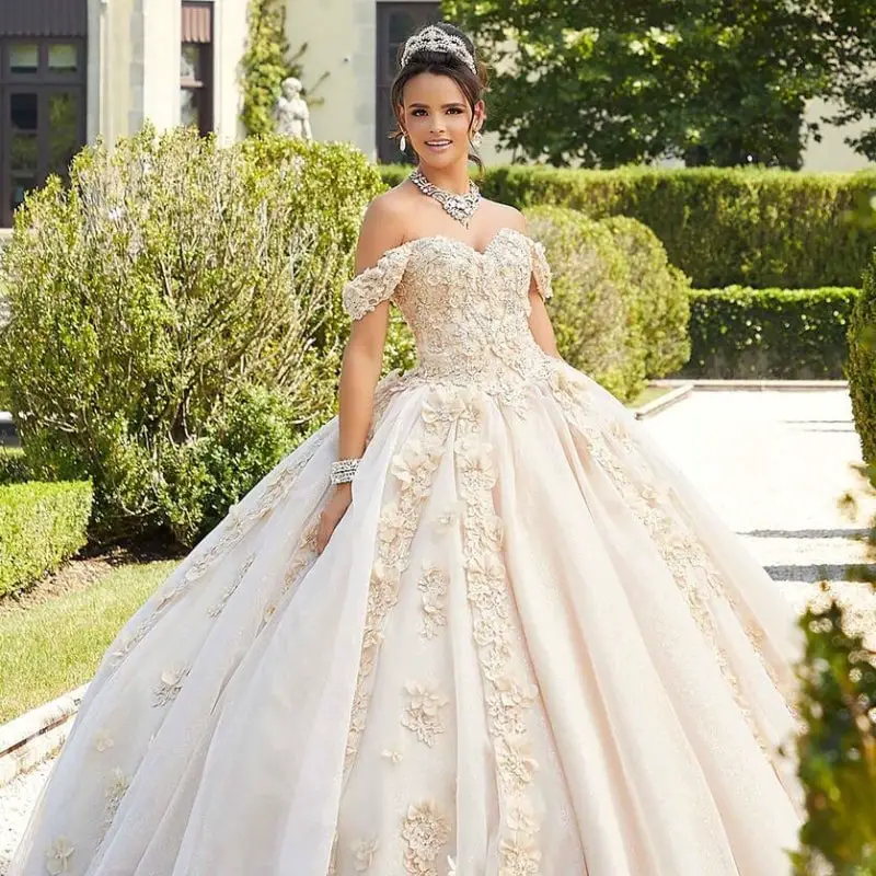 Cream Off Shoulder Ballgown With 3D Floral Appliques, Close-Up Take Cream Off Shoulder Ballgown With 3D Floral Appliques, Close-Up Take — Classy Quince Dress