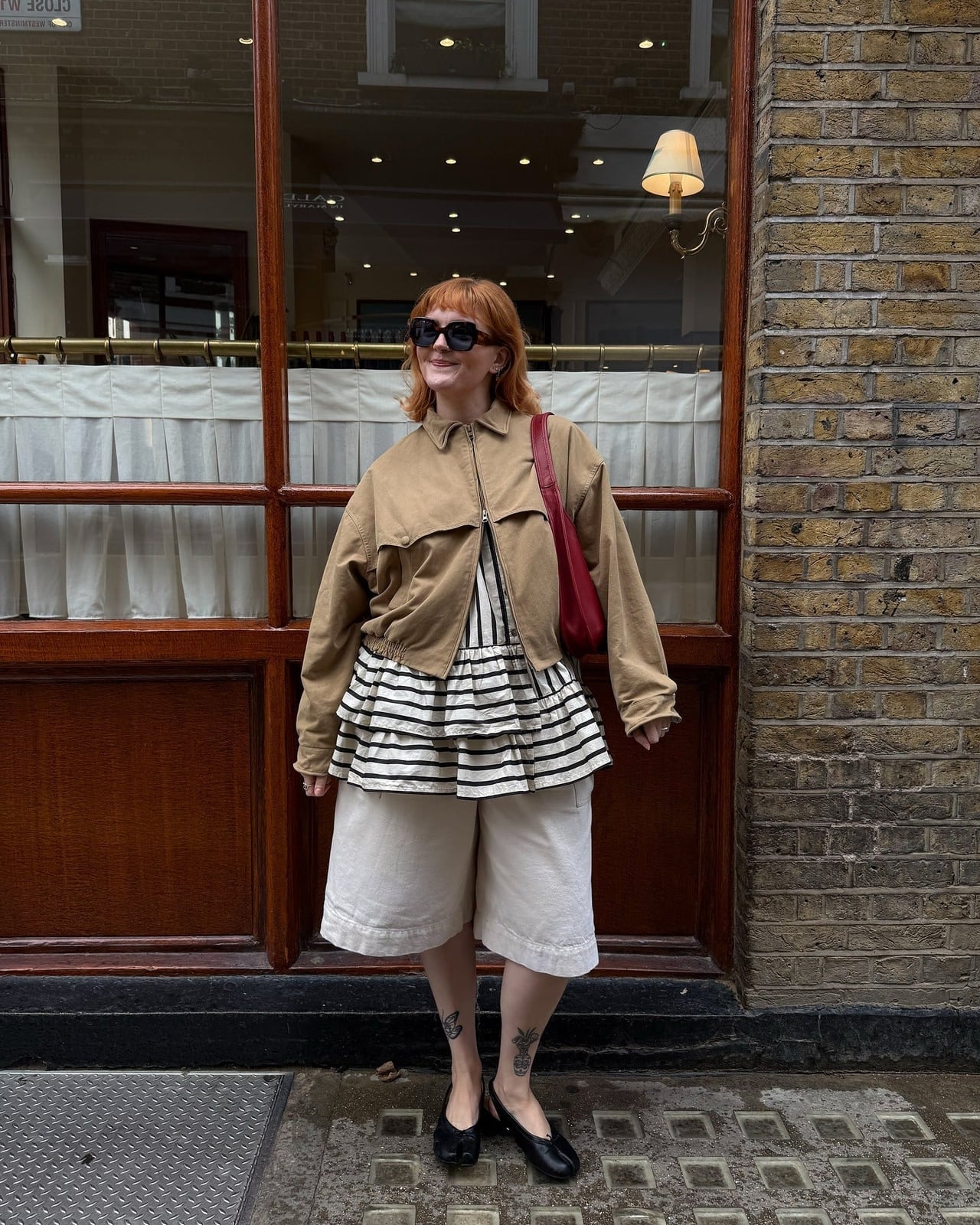 Tan Bomber Jacket Over Striped Top And Linen Shorts Tan Bomber Jacket Over Striped Top And Linen Shorts — Classy Rainy Day Outfits