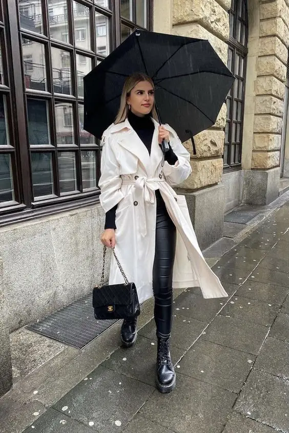 Ivory Trench Coat With Black Turtleneck And Leather Pants Ivory Trench Coat With Black Turtleneck And Leather Pants — Classy Rainy Day Outfits