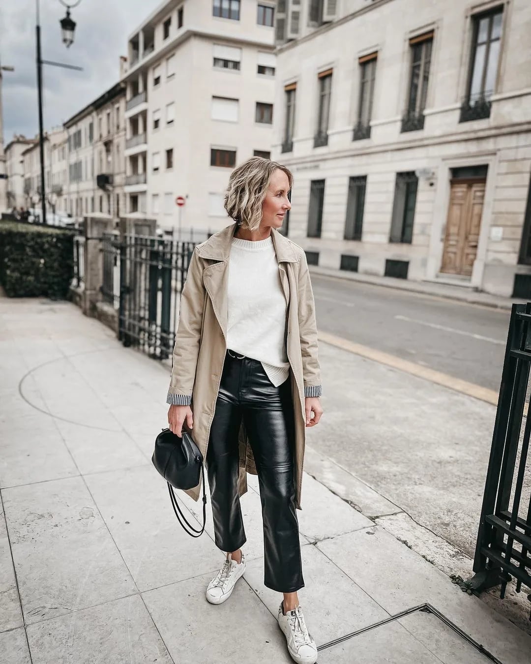 Beige Trench Coat Over Knit Sweater And Leather Trousers Beige Trench Coat Over Knit Sweater And Leather Trousers — Classy Rainy Day Outfits
