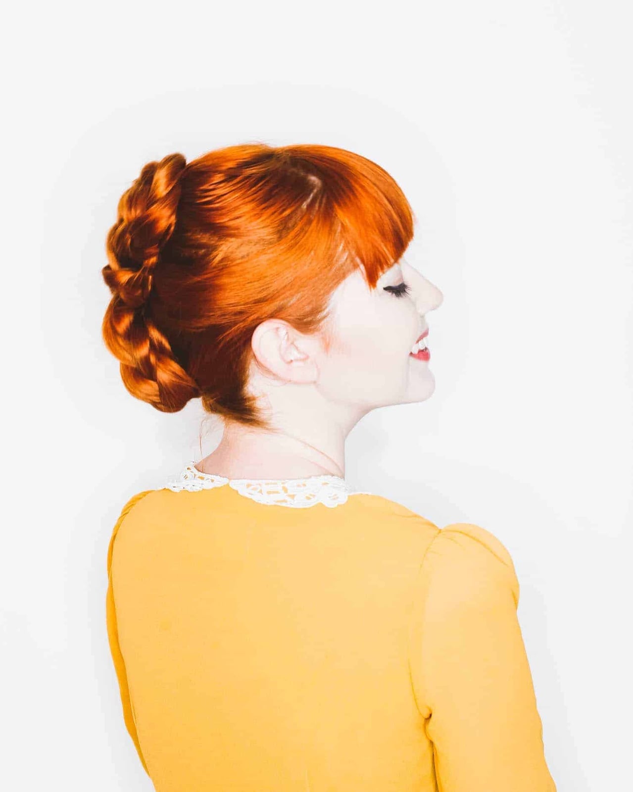 Vibrant Red Braided Bun With Side Part Vibrant Red Braided Bun With Side Part — Classy Red Braids