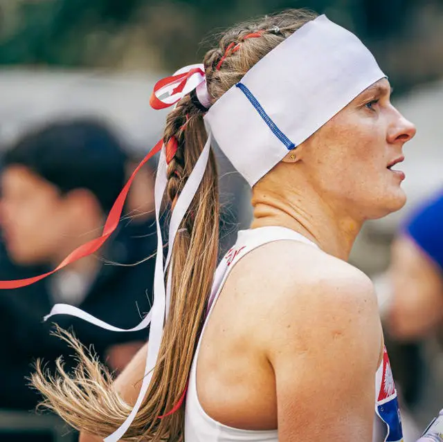 Blonde Ponytail With Braided Ribbon Accent — Classy Running Hairstyles