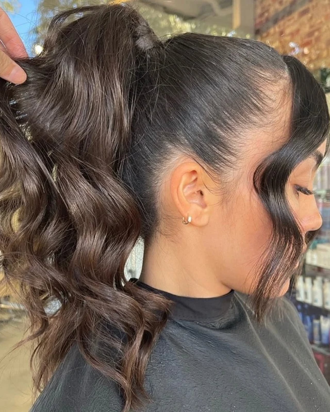 Voluminous Dark Brown Ponytail With Curtain Bangs — Classy Running Hairstyles
