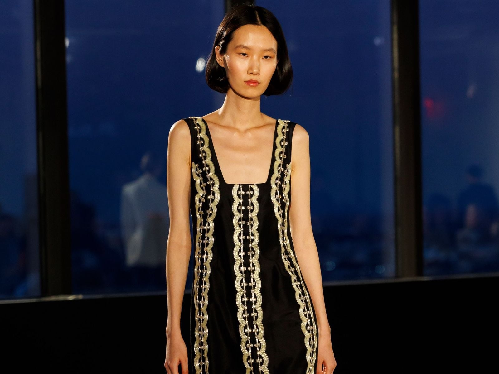 Black Sleeveless Dress with Gold Trim, Close-Up Take — Classy Runway Dresses