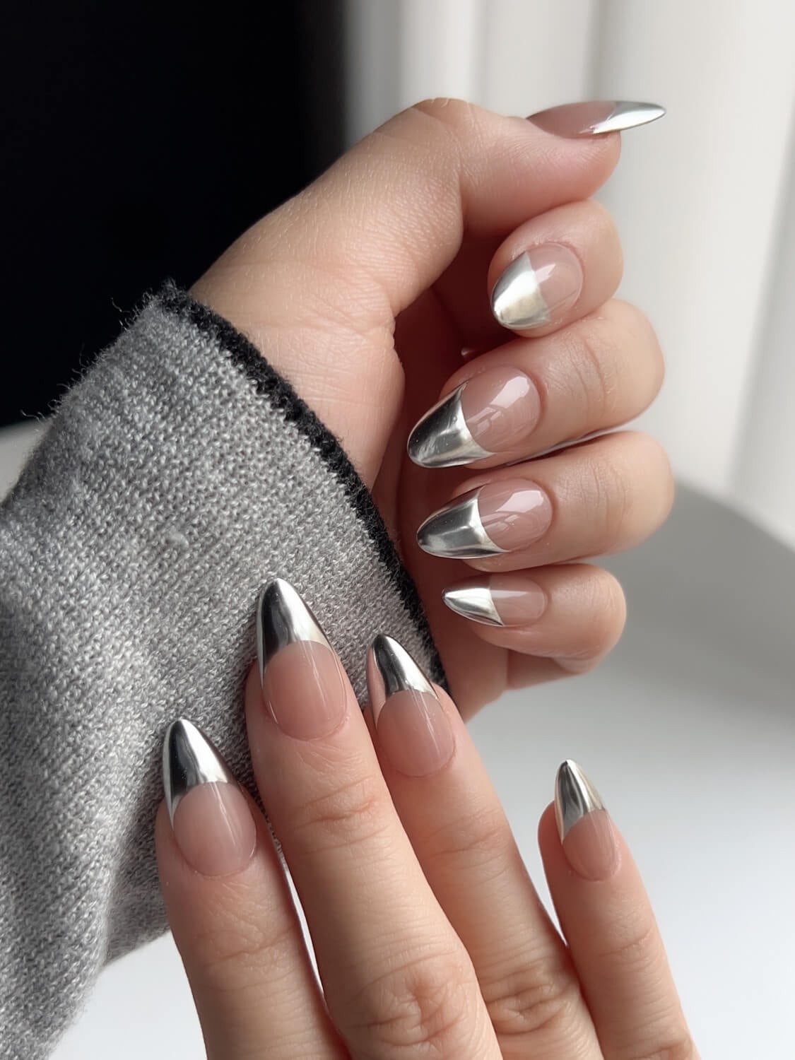 Medium Almond Nude Base With Silver Chrome French Tips Medium Almond Nude Base With Silver Chrome French Tips — Classy Silver Chrome Nails