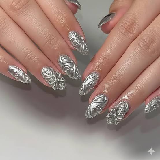 Medium Oval Silver Chrome With Raised Swirls And Flowers Medium Oval Silver Chrome With Raised Swirls And Flowers — Classy Silver Chrome Nails