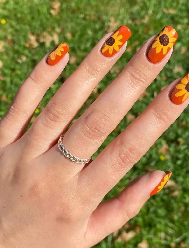Medium Oval Vibrant Orange With Sunflower Accents Medium Oval Vibrant Orange With Sunflower Accents — Classy Sunflower Nails