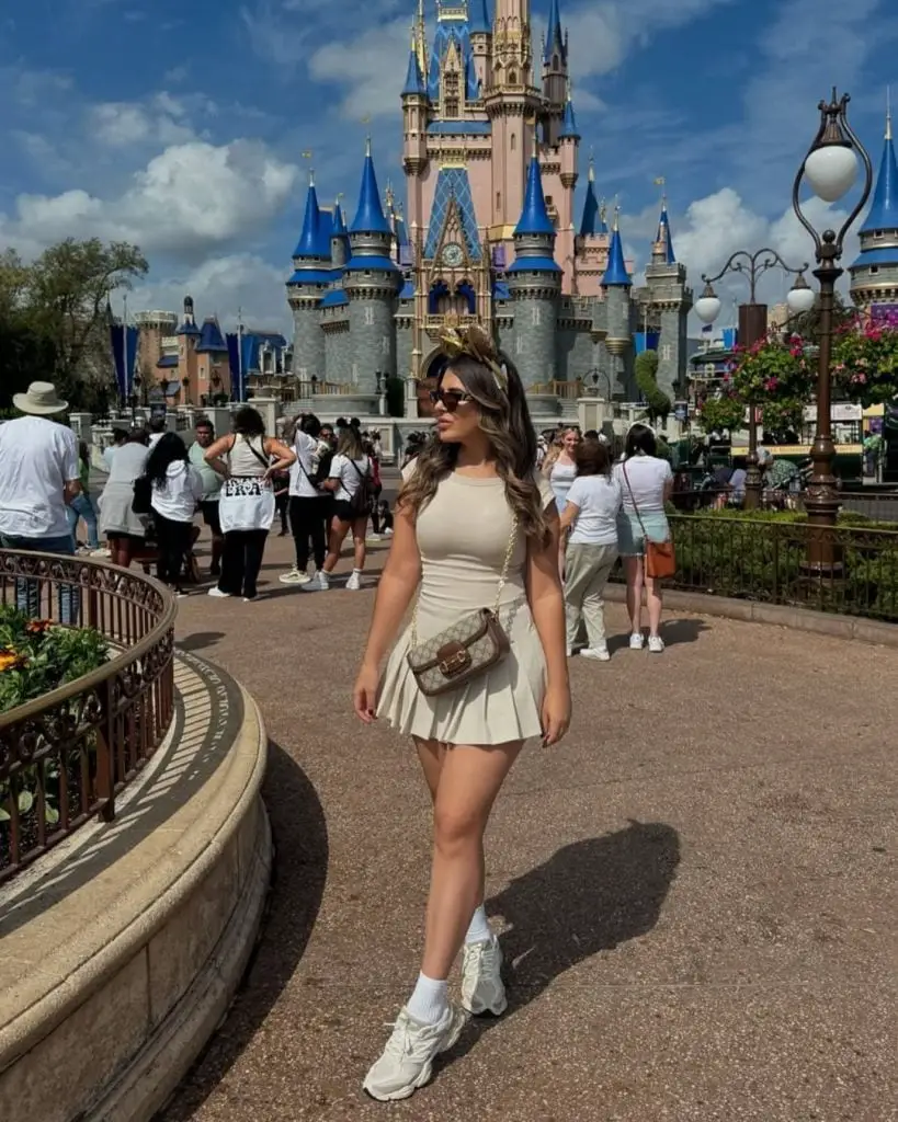 Beige Pleated Mini Dress and Chunky Sneakers Beige Pleated Mini Dress and Chunky Sneakers — Classy Theme Park Outfits