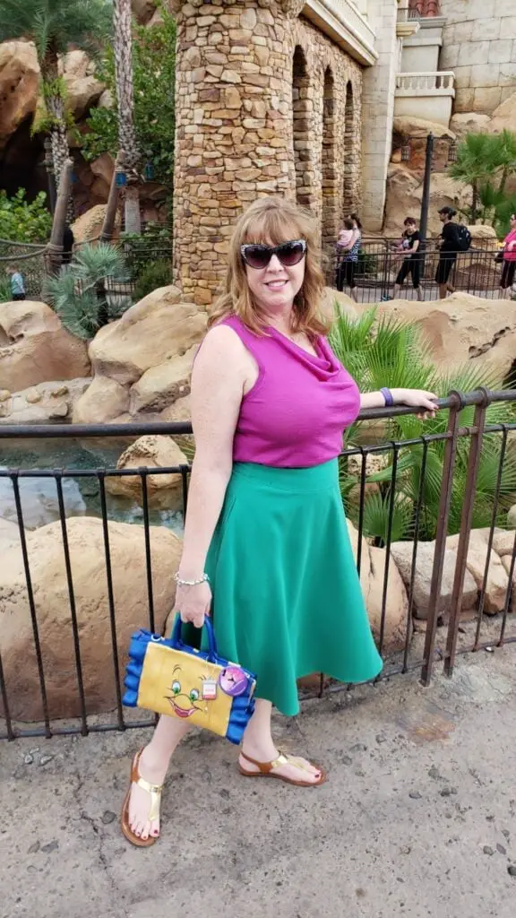 Green Midi Skirt and Pink Top with Character Handbag Green Midi Skirt and Pink Top with Character Handbag — Classy Theme Park Outfits