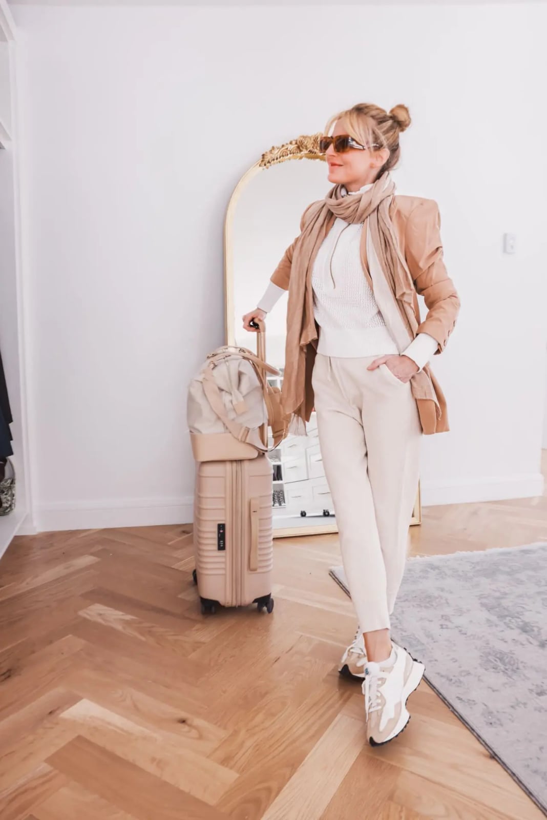 Tan Blazer Layered Over White Sweater and Cream Trousers — Classy Travel Outfits