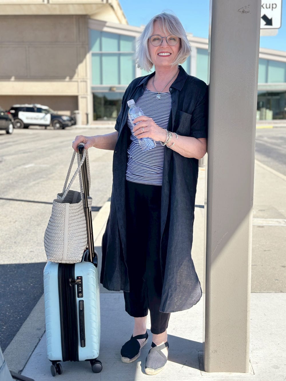 Longline Shirt Jacket Over Striped Tee and Cropped Pants — Classy Travel Outfits