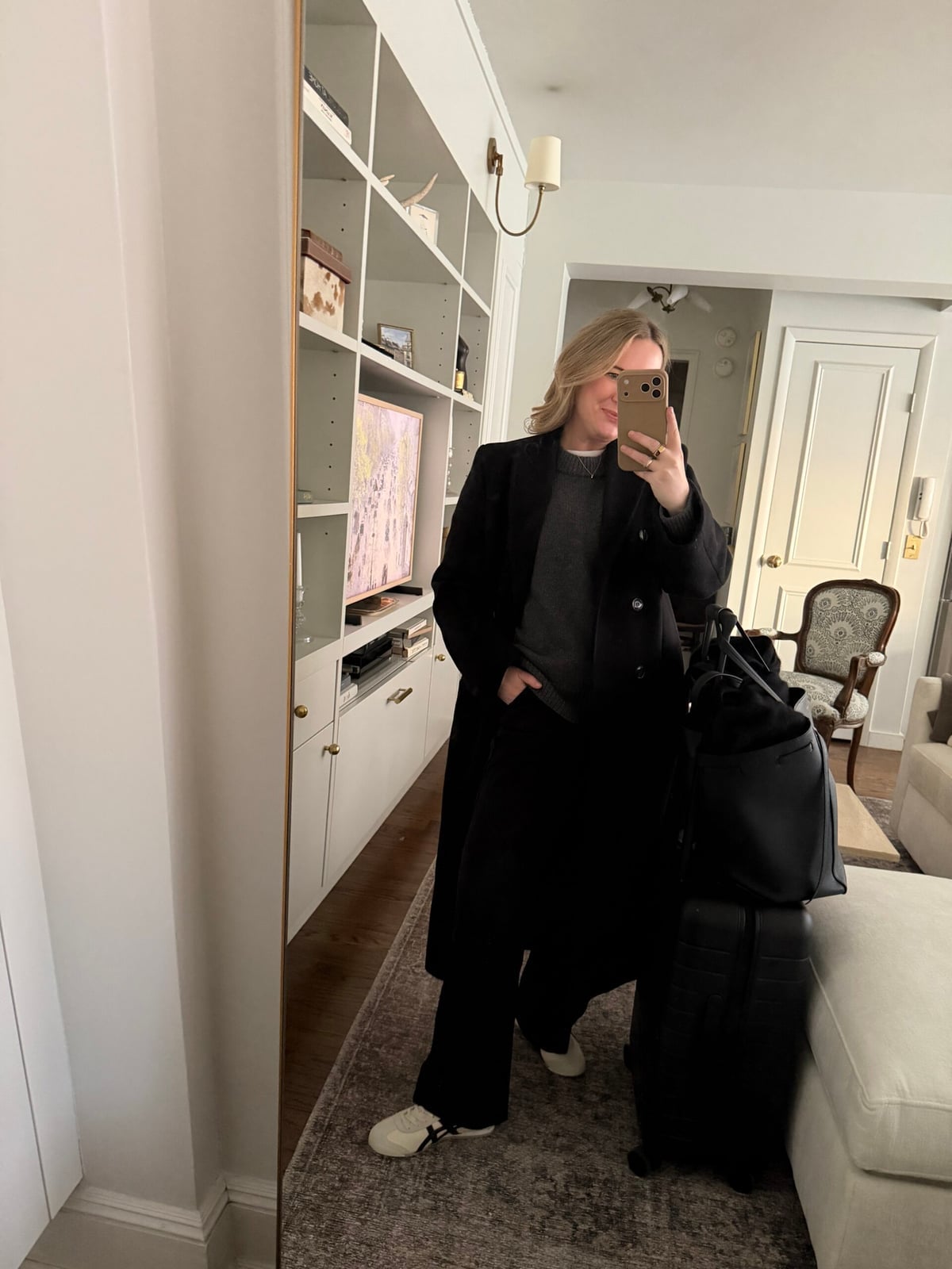 Long Black Coat Over Gray Sweater and Wide Leg Trousers — Classy Travel Outfits