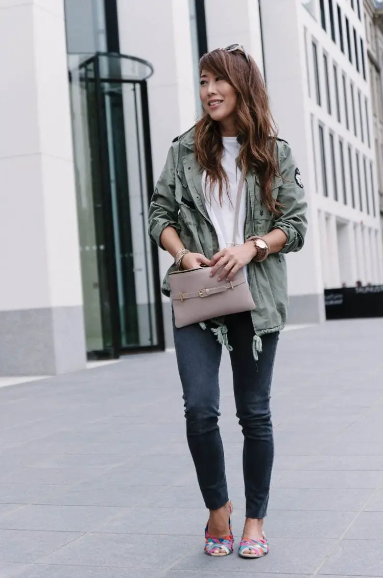 Green Utility Jacket Over T-Shirt and Slim Jeans — Classy Travel Outfits