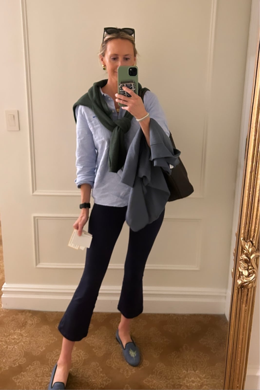 Navy Cropped Trousers with Draped Green Sweater — Classy Travel Outfits