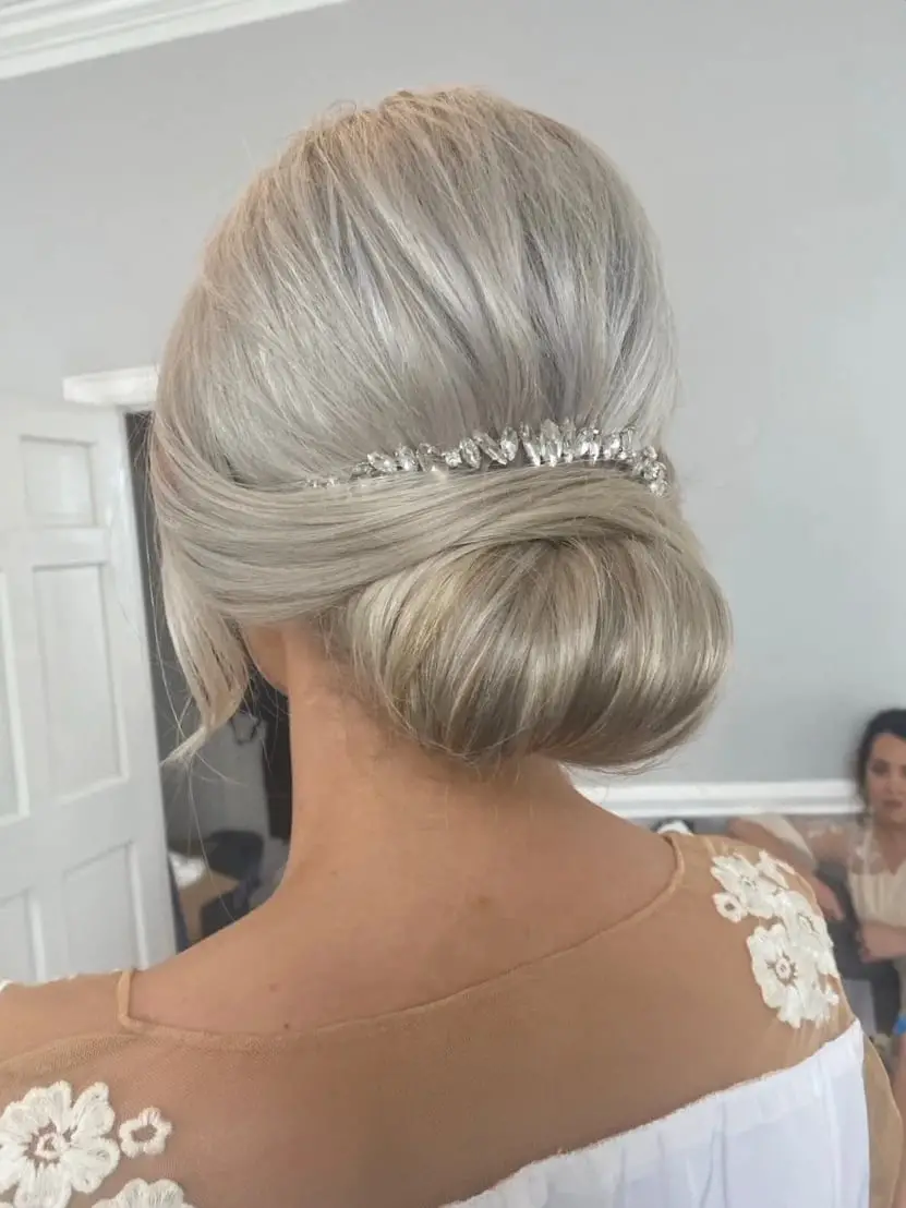 Ash Blonde Low Bun With Sparkling Accessory Ash Blonde Low Bun With Sparkling Accessory — Classy Updo Wig