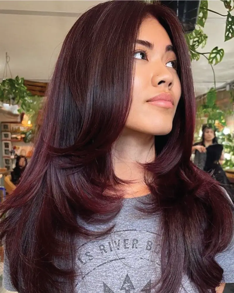 Deep Wine Red With Soft Waves And Curtain Bangs — Classy Wine Red Hair