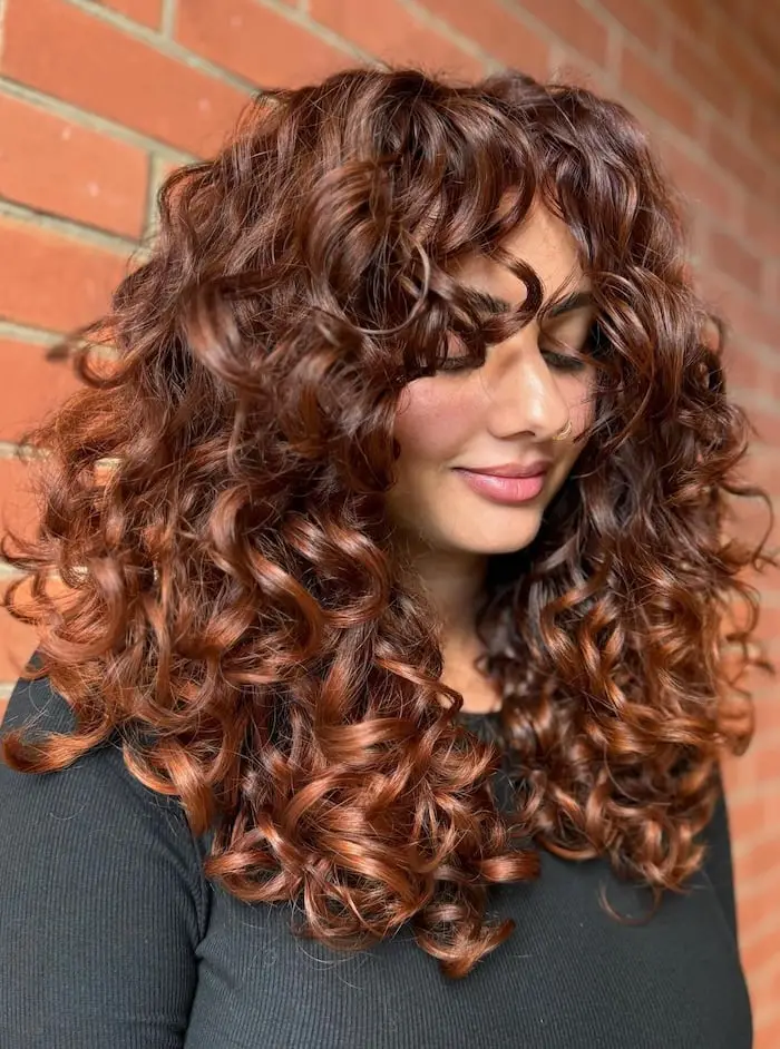 Collarbone Copper Shag With Full Bangs — Curly Hair Dye Inspiration