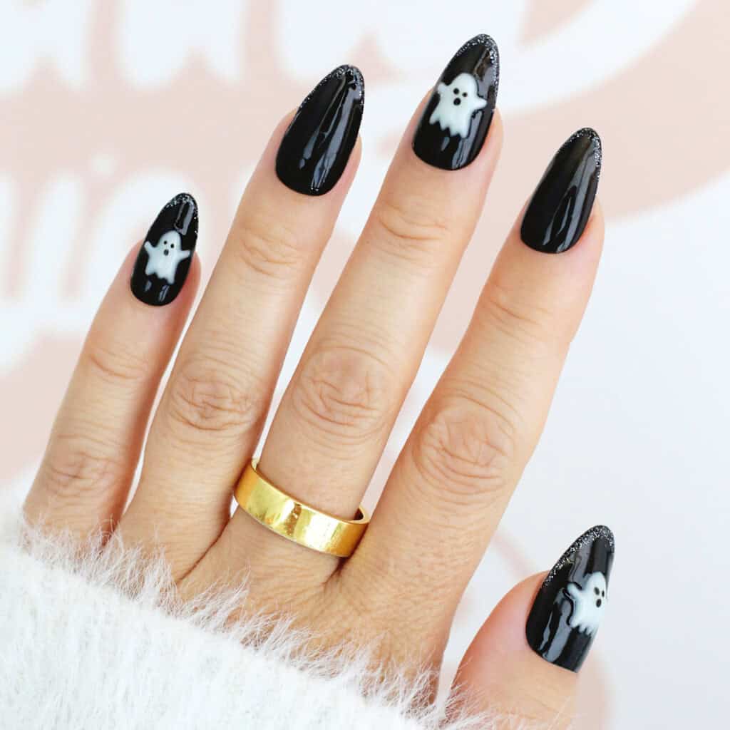 Medium Almond Black With White Ghosts and Glitter Tips Medium Almond Black With White Ghosts and Glitter Tips — Cute Black Nails