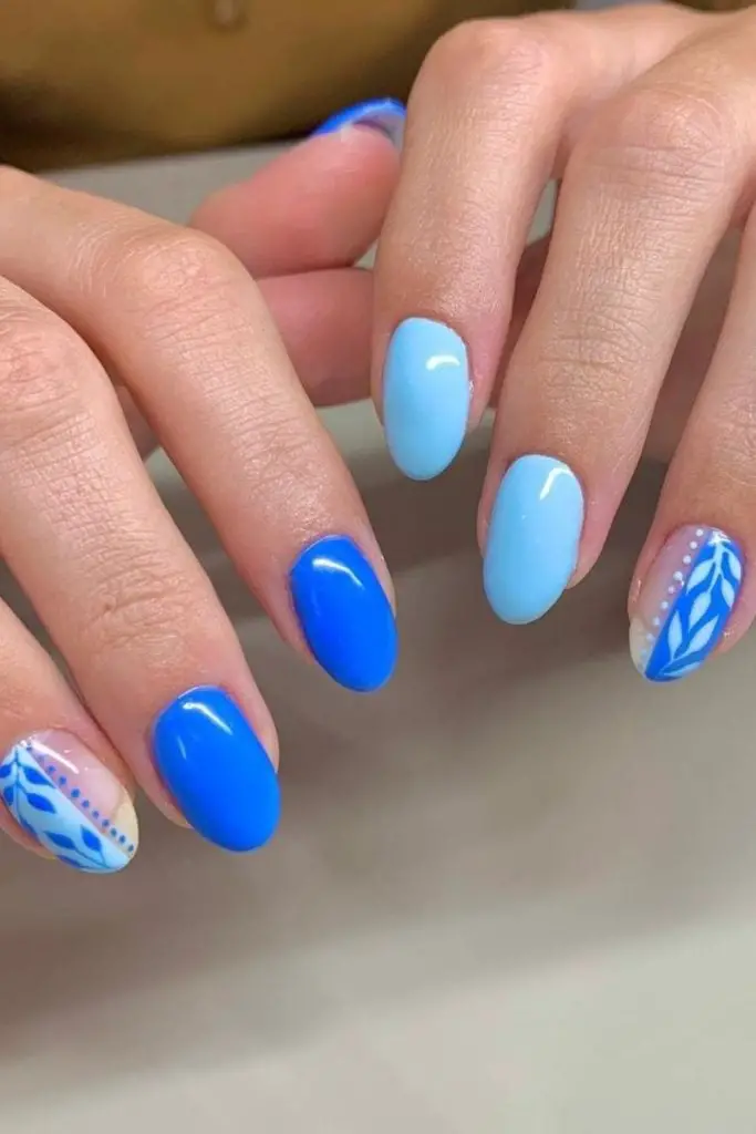 Short Almond Blue And Nude Leaf Pattern Nails — Cute Blue Nails